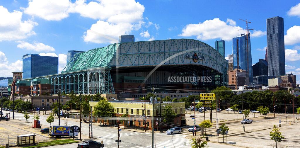 FILE - This Sept. 11, 2016 file photo shows a wide angle view of Minute Maid Park in downtown Houston. Major League Baseball has expanded its investigation into the Houston Astros after The Athletic website reported the team stole signs during home games in 2017 by using a camera positioned in center field. The report Tuesday, Nov. 12, 2019 quoted pitcher Mike Fiers, who played for the Astros that season, and three other unidentified people with the club. The Astros won the World Series that year — two sources told The Athletic that Houston used the system into the playoffs while another source said it ended before the postseason. (AP Photo/Juan DeLeon, file)