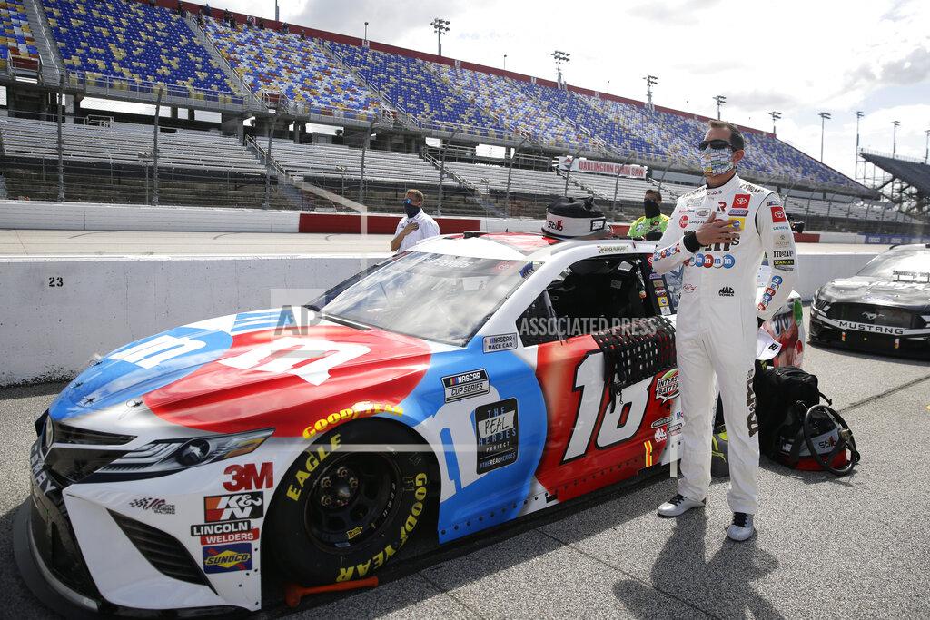 Brynn Anderson Kyle Busch stands for the playing of the national anthem before the start of the NASCAR Cup Series auto race Sunday, May 17, 2020, in Darlington, S.C. (AP Photo/Brynn Anderson)