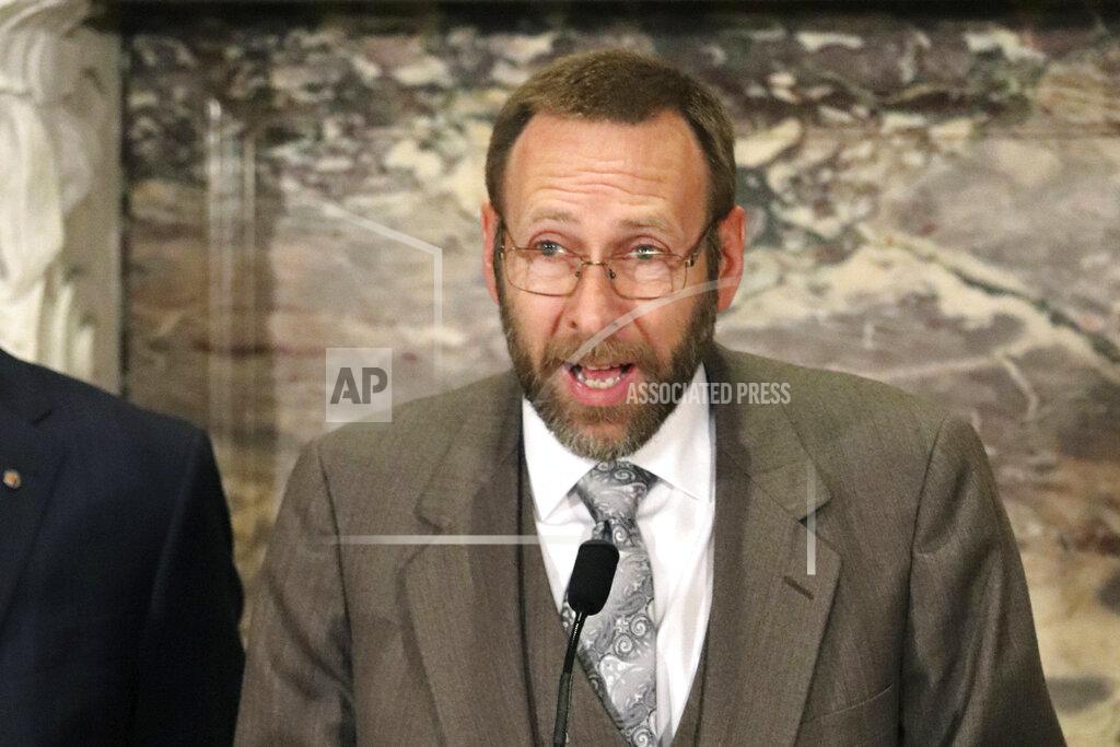 FILE - In this Jan. 30, 2018, file photo, Arkansas state Health Officer Dr. Nathaniel Smith speaks at the state Capitol in Little Rock, Ark. Smith announced Tuesday, May 26, 2020, he was resigning effective Aug. 28 for a job with the Centers for Disease Control and Prevention. (AP Photo/Kelly P. Kissel, File)