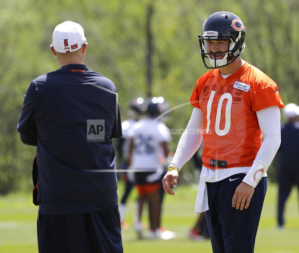 FILE - In this May 22, 2019, file photo, Chicago Bears quarterback Mitchell Trubisky, right, smiles as he talks with head coach Matt Nagy during NFL football practice in Lake Forest, Ill. Trubisky is facing some lofty expectations. Bigger things are expected in his second season under coach Matt Nagy and with the Chicago Bears winning the NFC North to reach the playoffs for the first time in eight years. (AP Photo/Nam Y. Huh, File)