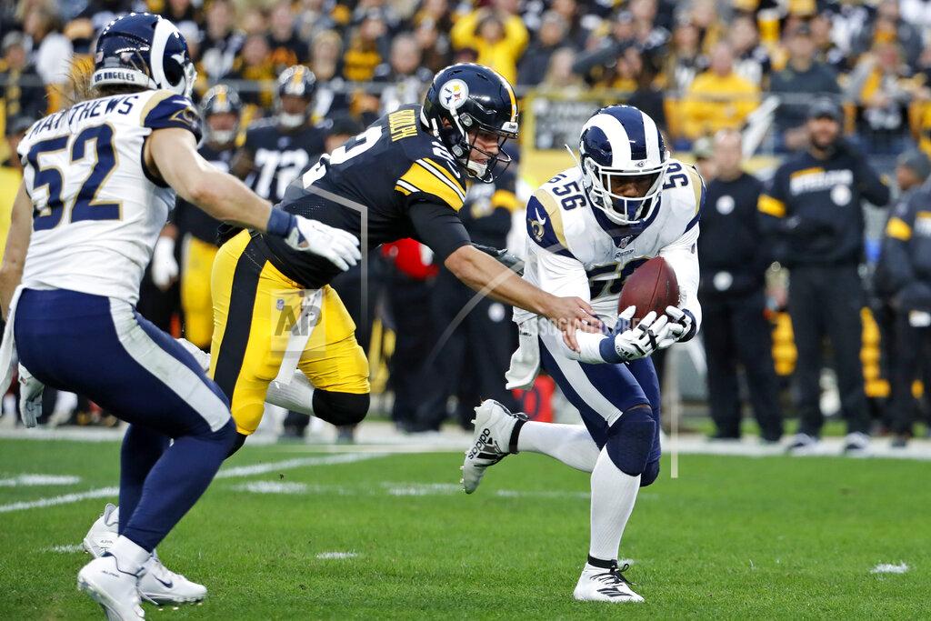 Don Wright Los Angeles Rams defensive end Dante Fowler (56) recovers a fumble in front of Pittsburgh Steelers quarterback Mason Rudolph (2) and returns it for a touchdown during the first half of an NFL football game in Pittsburgh, Sunday, Nov. 10, 2019. (AP Photo/Don Wright)