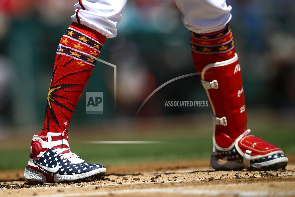 Nick Wass Washington Nationals' Nelson Cruz wears patriotic themed shoes during is at bat during the first inning of a baseball game against the Miami Marlins, Monday, July 4, 2022, in Washington. (AP Photo/Nick Wass)