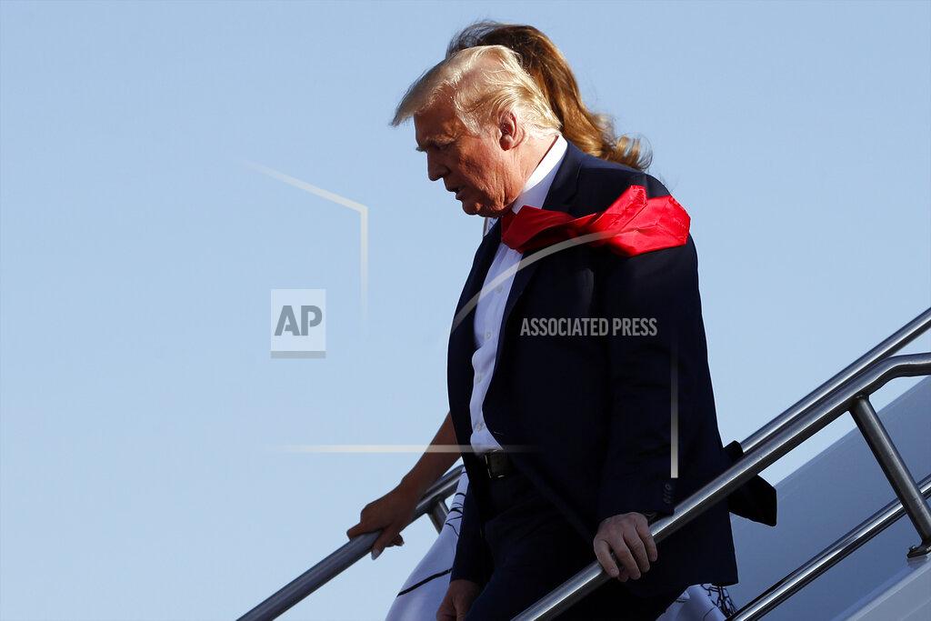 Alex Brandon President Donald Trump and first Lady Melania Trump step off Air Force One upon arrival at Ellsworth Air Force Base, S.D., Friday, July 3, 2020. Trump is en route to Mount Rushmore National Memorial. (AP Photo/Alex Brandon)