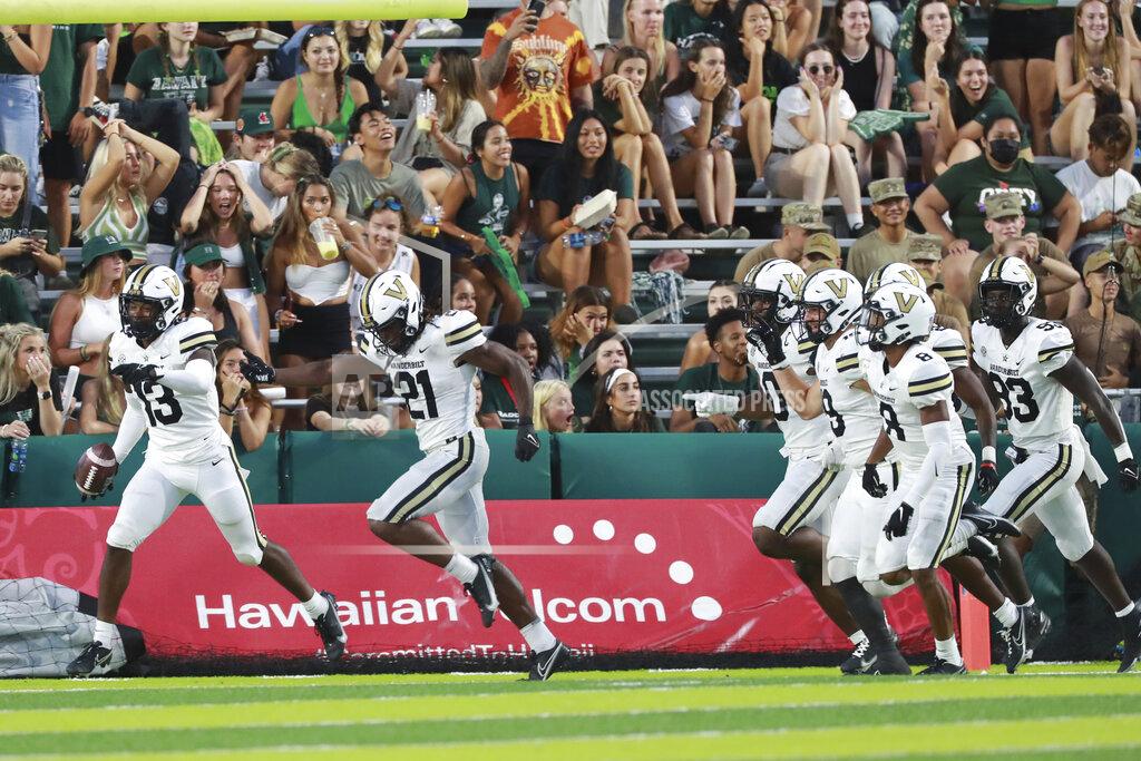 Marco Garcia The Vanderbilt offensive line reacts in the end zone after Vanderbilt linebacker CJ Taylor (13) carried a Hawaii fumble in for a touchdown during the second half of an NCAA college football game, Saturday, Aug. 27, 2022, in Honolulu. (AP Photo/Marco Garcia)