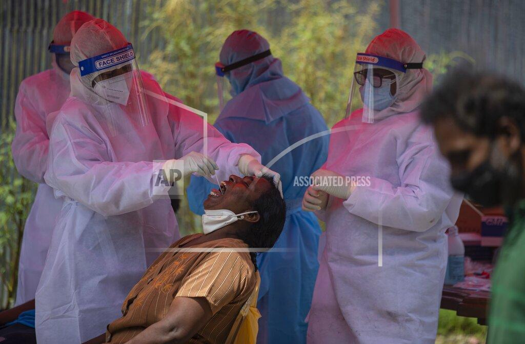 Eranga Jayawardena Sri Lankan health officials collect swab samples from people to test for the coronavirus in Colombo, Sri Lanka, Thursday, June 10, 2021. (AP Photo/Eranga Jayawardena)