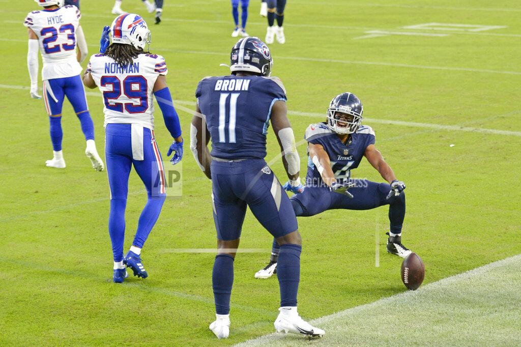 Mark Zaleski Tennessee Titans wide receiver A.J. Brown (11) celebrates with wide receiver Kalif Raymond (14) after Brown caught a touchdown pass against the Buffalo Bills in the first half of an NFL football game Tuesday, Oct. 13, 2020, in Nashville, Tenn. Defending against Brown was Bills cornerback Josh Norman (29). (AP Photo/Mark Zaleski)