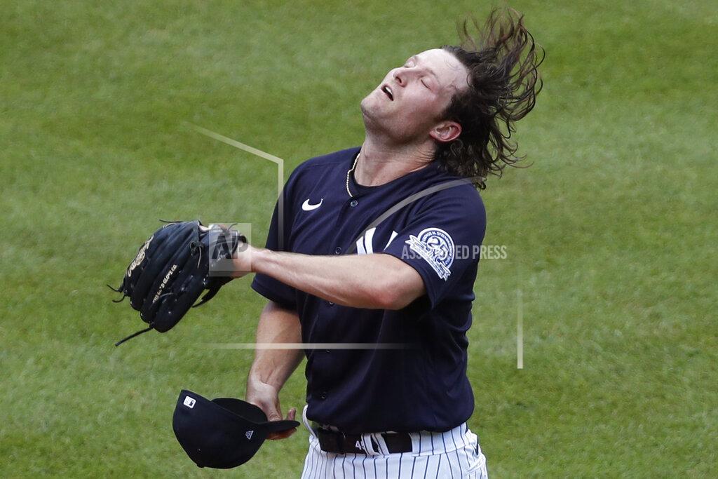 Kathy Willens New York Yankees starting pitcher Gerrit Cole flips his hair before donning his cap between batters during an intrasquad game in baseball summer training camp Sunday, July 12, 2020, at Yankee Stadium in New York. (AP Photo/Kathy Willens)