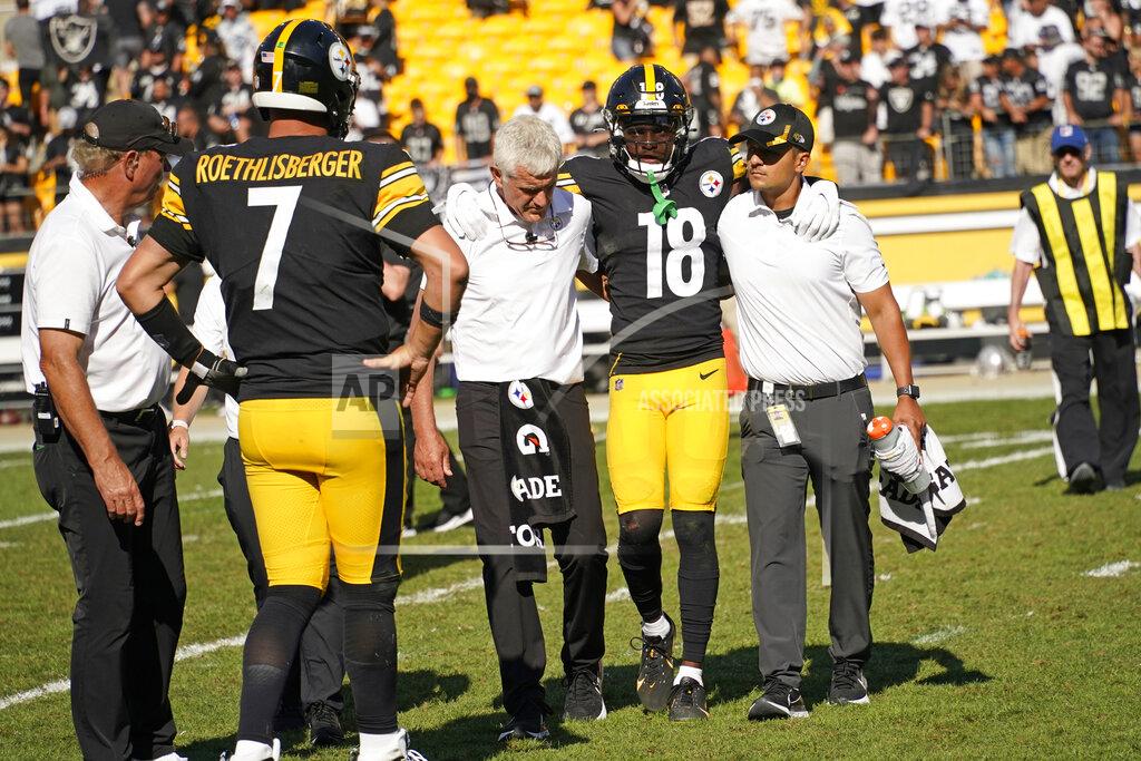 Keith Srakocic Pittsburgh Steelers quarterback Ben Roethlisberger (7) watches as wide receiver Diontae Johnson (18) is helped off the field after being injured during the second half of an NFL football game against the Las Vegas Raiders in Pittsburgh, Sunday, Sept. 19, 2021. (AP Photo/Keith Srakocic)