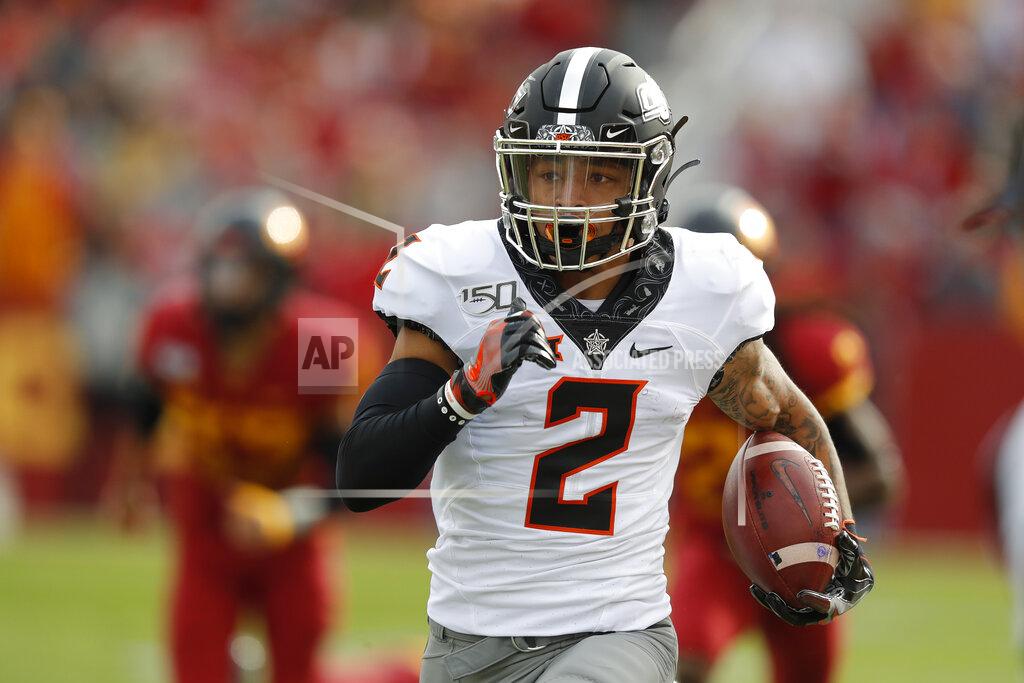 Matthew Putney Oklahoma State wide receiver Tylan Wallace breaks free from Iowa State defense to score a touchdown during the first half of an NCAA college football game, Saturday, Oct. 26, 2019, in Ames, Iowa. (AP Photo/Matthew Putney)