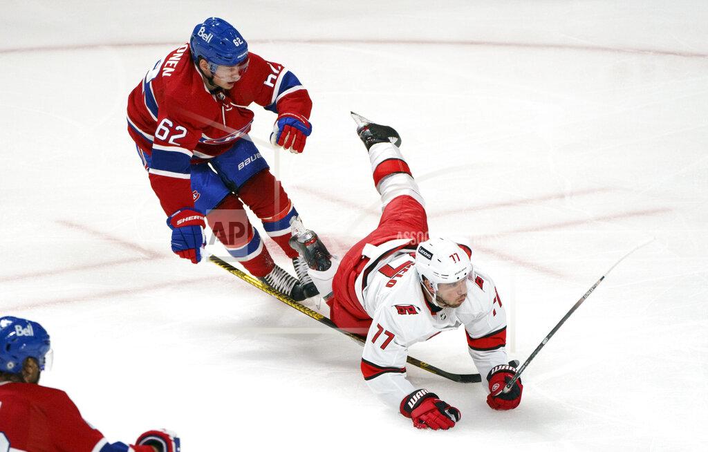 Paul Chiasson Carolina Hurricanes' Tony DeAngelo falls in front of Montreal Canadiens' Artturi Lehkonen during the second period of an NHL hockey game Thursday, Oct. 21, 2021, in Montreal. (Paul Chiasson/The Canadian Press via AP)