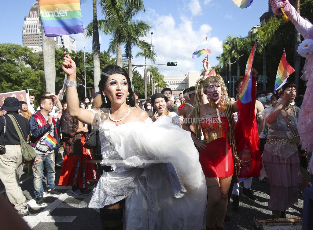 Chiang Ying-Ying Participants march through a street during a pride parade in Taipei, Taiwan, Saturday, Oct. 31, 2020. (AP Photo/Chiang Ying-ying)