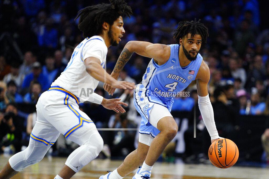 Chris Szagola North Carolina's R.J. Davis, right, drives against UCLA's Tyger Campbell during the first half of a college basketball game in the Sweet 16 round of the NCAA tournament, Friday, March 25, 2022, in Philadelphia. (AP Photo/Chris Szagola)