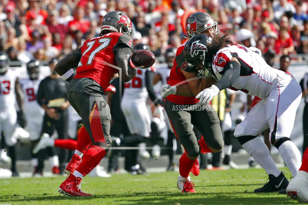Mark Lomoglio Tampa Bay Buccaneers running back Ronald Jones II (27) fumbles the football on a run against the Atlanta Falcons during the first half of an NFL football game Sunday, Dec. 29, 2019, in Tampa, Fla. Atlanta recovered the fumble. (AP Photo/Mark LoMoglio)
