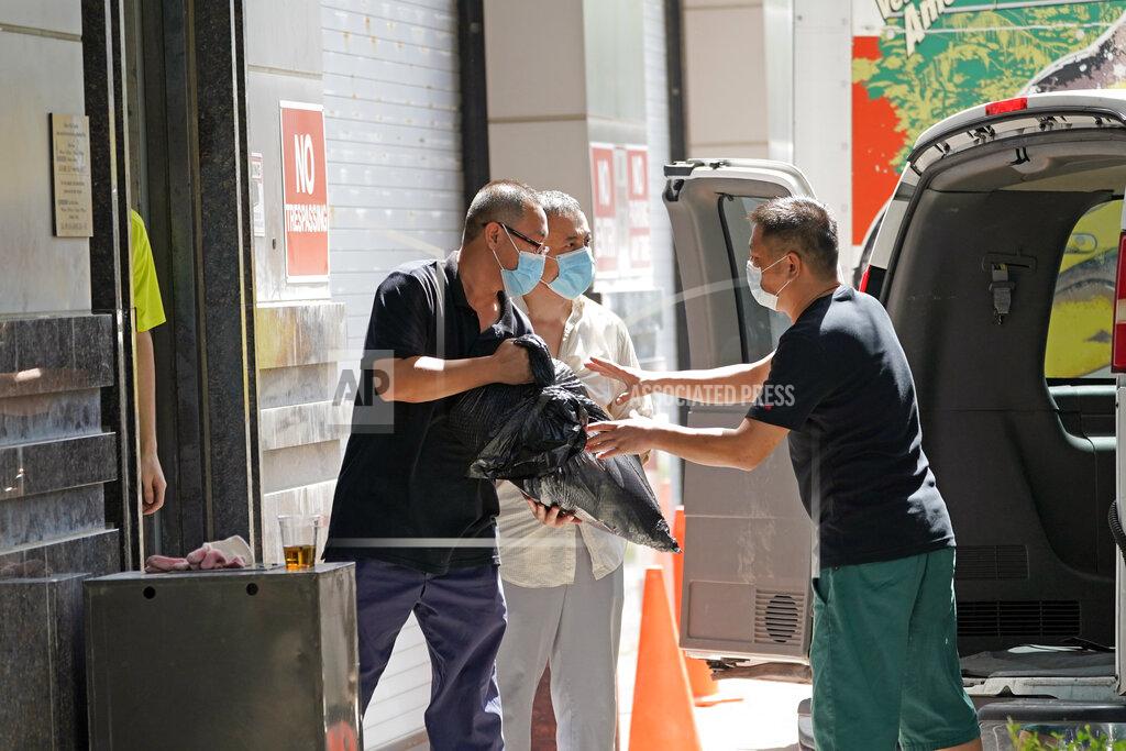 David J. Phillip People remove bags from inside the Chinese Consulate as they load a van Thursday, July 23, 2020, in Houston. China says “malicious slander" is behind an order by the U.S. government to close its consulate in Houston, and maintains that its officials have never operated outside ordinary diplomatic norms. (AP Photo/David J. Phillip)