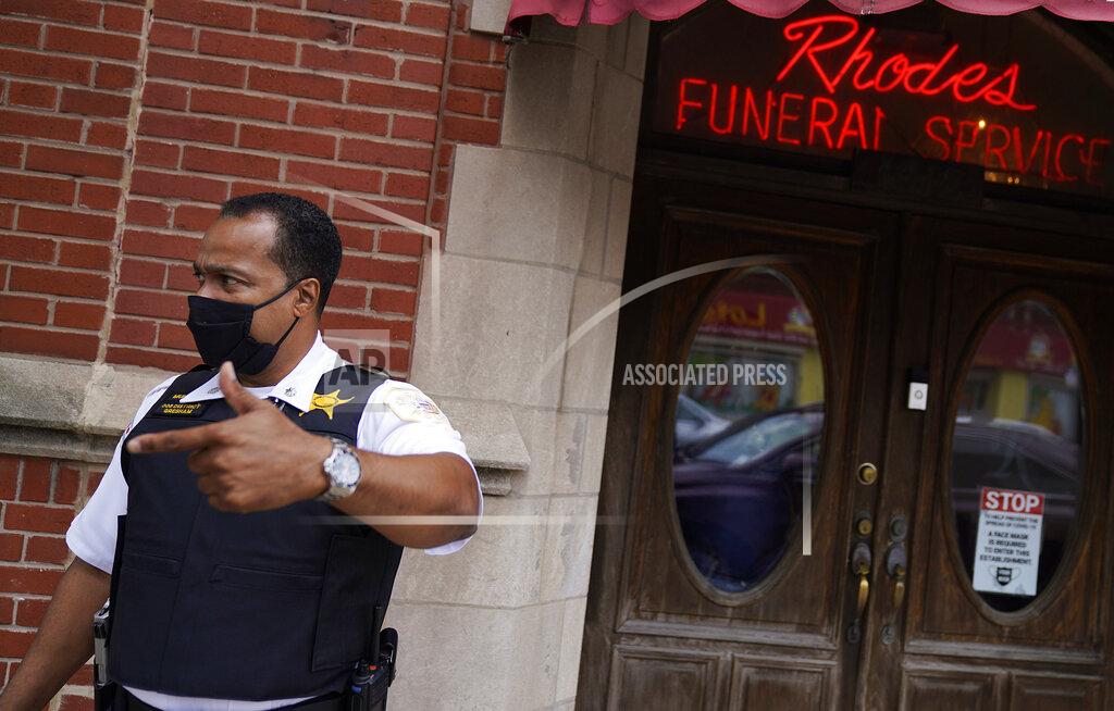 David Goldman Police Commander Rahman Muhammad stands outside a funeral home where a shootout wounded 15, in the Auburn Gresham neighborhood in Chicago, Tuesday, Aug. 25, 2020. Muhammad says there's been a big shift since he began work in the 6th district 25 years ago when gun violence revolved around narcotics or some other criminal enterprise. Now, he says, social media is often the driving force behind the shootings. Disputes often start out online as gang members who've grown up together are now rivals taunting each other over petty matters that escalate into tragedy. (AP Photo/David Goldman)