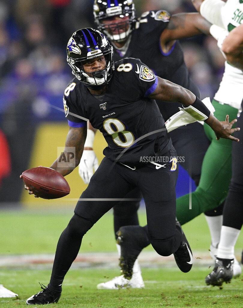 Nick Wass FILE - In this Dec. 12, 2019, file photo, Baltimore Ravens quarterback Lamar Jackson (8) scrambles against the New York Jets during the first half of an NFL football game, in Baltimore. The Baltimore Ravens bring a 12-game winning streak into their playoff matchup with the Tennessee Titans in Saturday night. (AP Photo/Nick Wass, File)