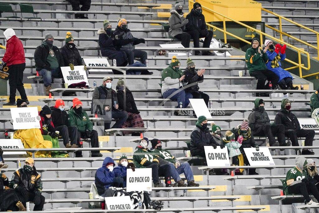 Morry Gash A limited number of fans at Lambeau Field watch during the first half of an NFL football game between the Green Bay Packers and the Chicago Bears Sunday, Nov. 29, 2020, in Green Bay, Wis. (AP Photo/Morry Gash)