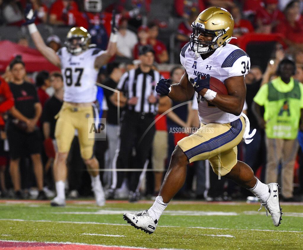 Eric Christian Smith Navy fullback Jamale Carothers (34) runs in to the end zone for a touchdown during the first half of an NCAA college football game against Houston, Saturday, Nov. 30, 2019, in Houston. (AP Photo/Eric Christian Smith)