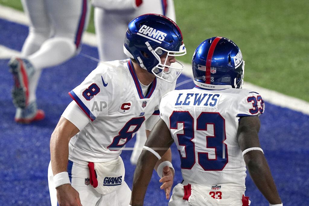 Corey Sipkin New York Giants' Dion Lewis, right, celebrates his touchdown with quarterback Daniel Jones during the first half of an NFL football game, Monday, Nov. 2, 2020, in East Rutherford, N.J. (AP Photo/Corey Sipkin)