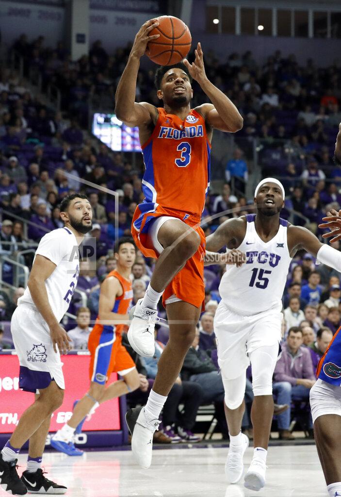Tony Gutierrez Florida guard Jalen Hudson (3) breaks to the basket after getting past TCU's Alex Robinson, left, and JD Miller (15) in the first half of an NCAA college basketball game in Fort Worth, Texas, Saturday, Jan. 26, 2019. (AP Photo/Tony Gutierrez)