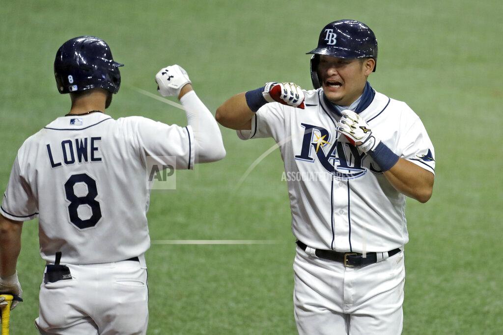 Chris O'meara Tampa Bay Rays' Yoshi Tsutsugo, of Japan, right, celebrates with Brandon Lowe after Tsutsugo scored on a sacrifice fly by Michael Perez off New York Yankees relief pitcher Adam Ottavino during the eighth inning of a baseball game Friday, Aug. 7, 2020, in St. Petersburg, Fla. (AP Photo/Chris O'Meara)
