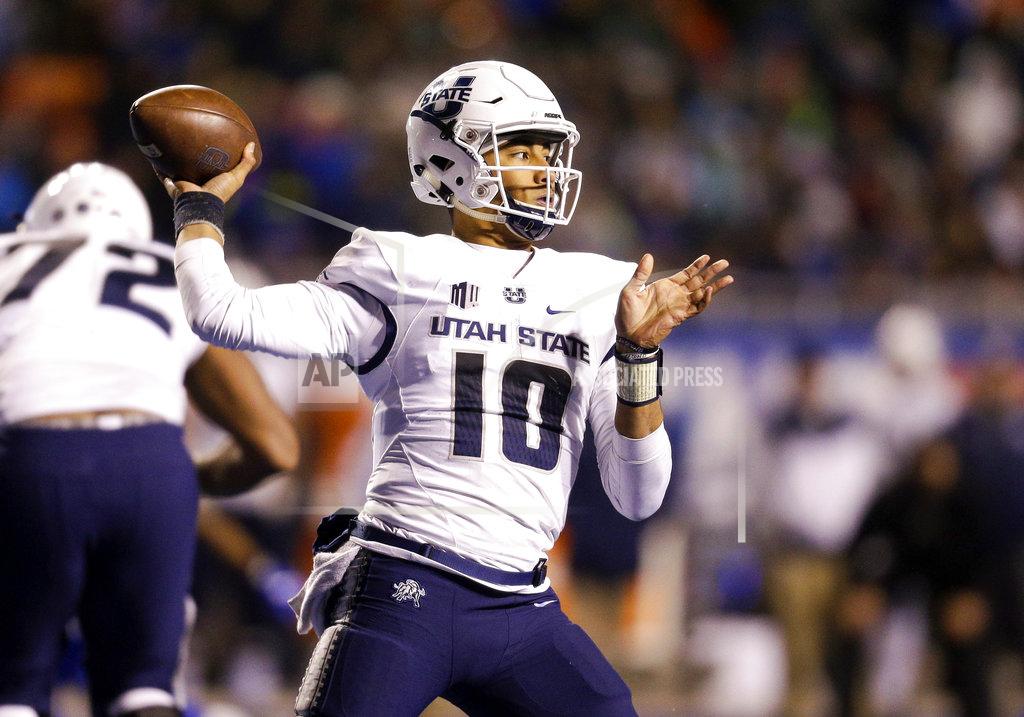 Steve Conner Utah State quarterback Jordan Love (10) looks to throw the ball against Boise State in the second of an NCAA college football game, Saturday, Nov. 24, 2018, in Boise, Idaho. Boise State won 33-24. (AP Photo/Steve Conner)