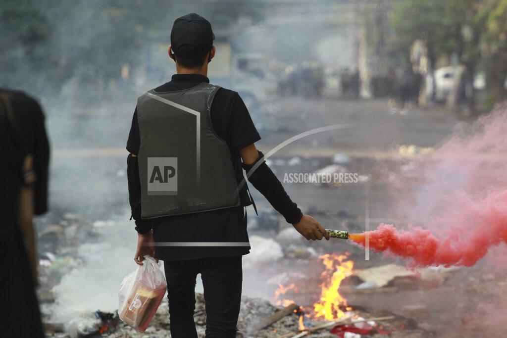 Mg Ny@N Anti-coup demonstrators prepare to confront police during a protest in Tarmwe township, Yangon, Myanmar, Thursday, April 1, 2021. (AP Photo)