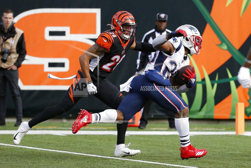 Frank Victores New England Patriots running back James White, right, runs the ball in for a touchdown against Cincinnati Bengals cornerback Greg Mabin (26) in the first half of an NFL football game, Sunday, Dec. 15, 2019, in Cincinnati. (AP Photo/Frank Victores)