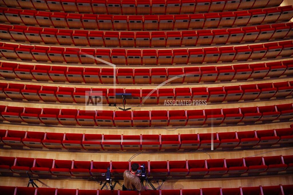 A cameraman prepares for the video recording of "Despo-Greek Dances" Opera and dance performance at the empty Greek National Opera in Athens, Saturday, March 6, 2021. Dozens of museum exhibitions, theater productions, discussion panels and historical re-enactments were planned in Greece for this year to commemorate the bicentennial of the 1821-1832 Greek War of Independence. But due to the coronavirus pandemic, mezzo-soprano Artemis Bogri and her fellow singers stepped onstage in an empty theater to perform the Greek National Opera’s new production of “Despo,” one of the events marking 200 years since the war that resulted in Greece’s independence from the Ottoman Empire and rebirth as a nation. (AP Photo/Thanassis Stavrakis)
