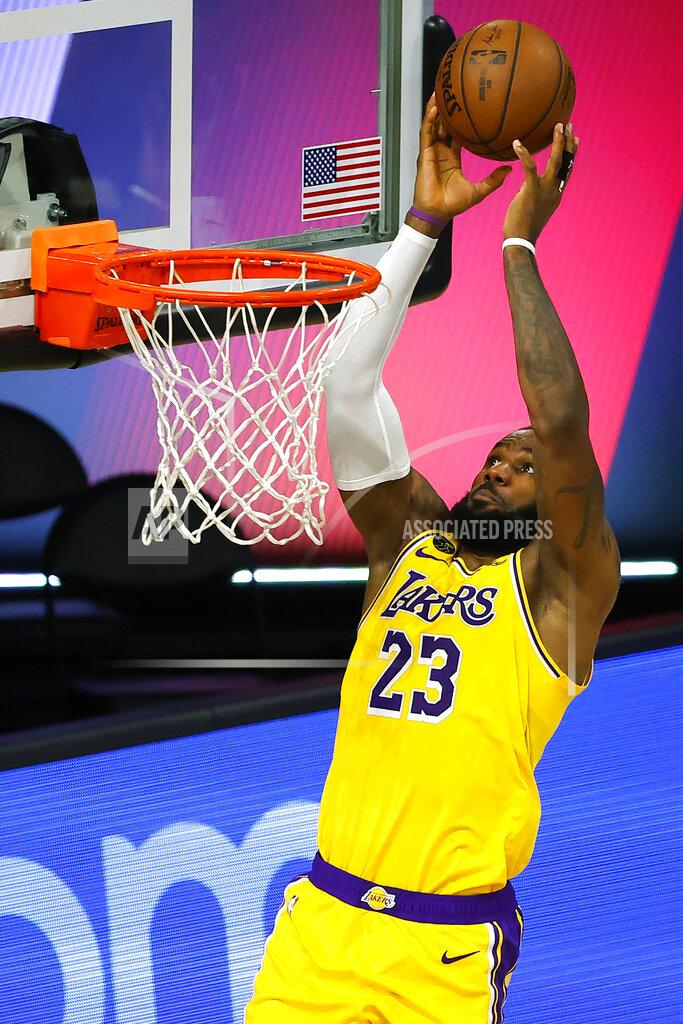 Kevin C. Cox Los Angeles Lakers' LeBron James goes up for a shot against the Sacramento Kings during the second quarter of an NBA basketball game Thursday, Aug. 13, 2020, in Lake Buena Vista, Fla. (Kevin C. Cox/Pool Photo via AP)