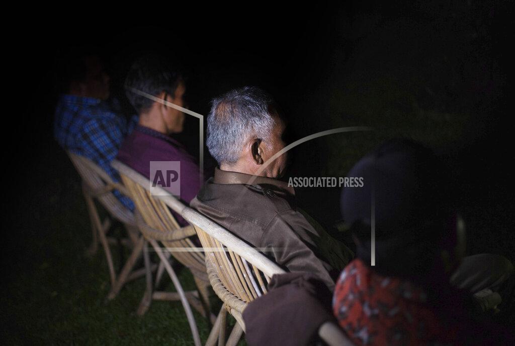 Binsar Bakkara Palm oil workers gather in Sumatra, Indonesia, on Friday, Sept. 7, 2018, to discuss labor abuses that plague the industry. Many interviews with The Associated Press took place secretly in homes or shops in towns or villages near plantations, sometimes late at night, to protect workers from potential retaliation. (AP Photo/Binsar Bakkara)