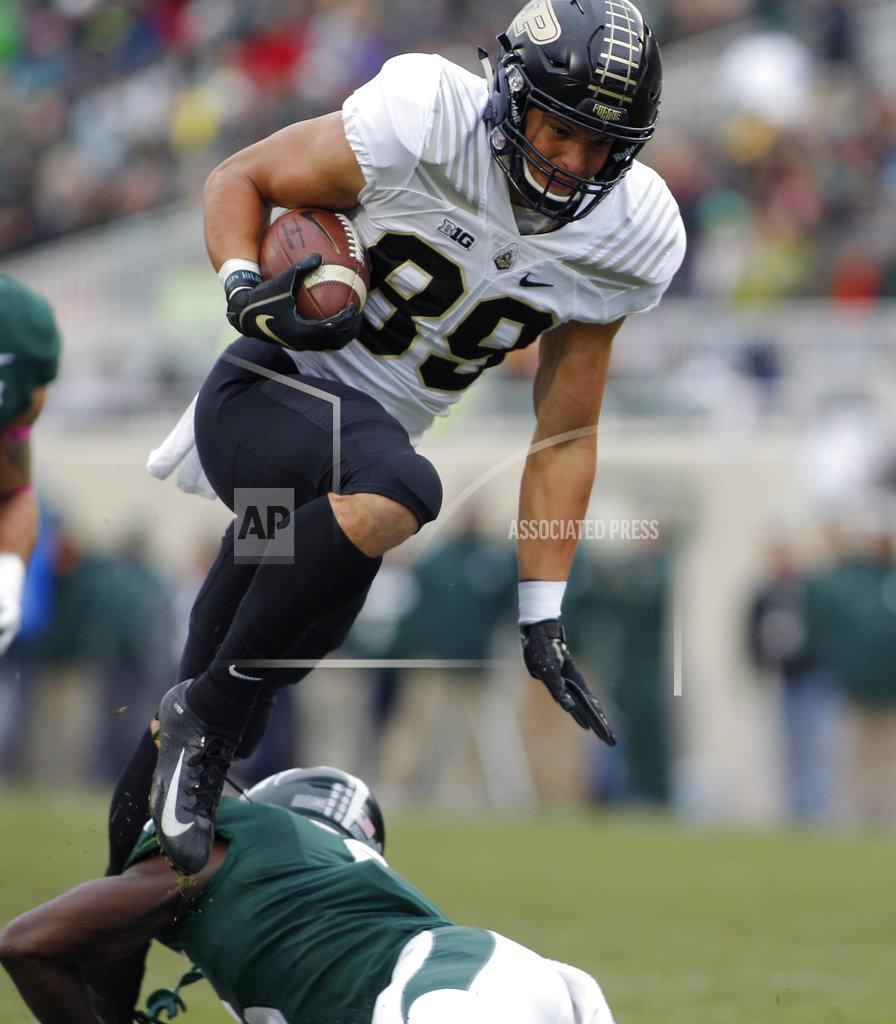 Al Goldis Purdue's Brycen Hopkins leaps over Michigan State's David Dowell on a pass reception during the first quarter of an NCAA college football game, Saturday, Oct. 27, 2018, in East Lansing, Mich. (AP Photo/Al Goldis)