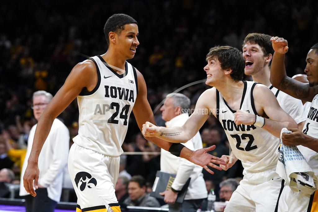 Charlie Neibergall Iowa forward Kris Murray (24) celebrates with teammate Patrick McCaffery (22) at the end of an NCAA college basketball game against Indiana, Thursday, Jan. 13, 2022, in Iowa City, Iowa. Iowa won 83-74. (AP Photo/Charlie Neibergall)