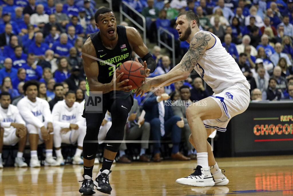 Adam Hunger Michigan State forward Xavier Tillman (23) drives to the basket past Seton Hall forward Sandro Mamukelashvili during the first half of an NCAA college basketball game Thursday, Nov. 14, 2019, in Newark, N.J. (AP Photo/Adam Hunger)