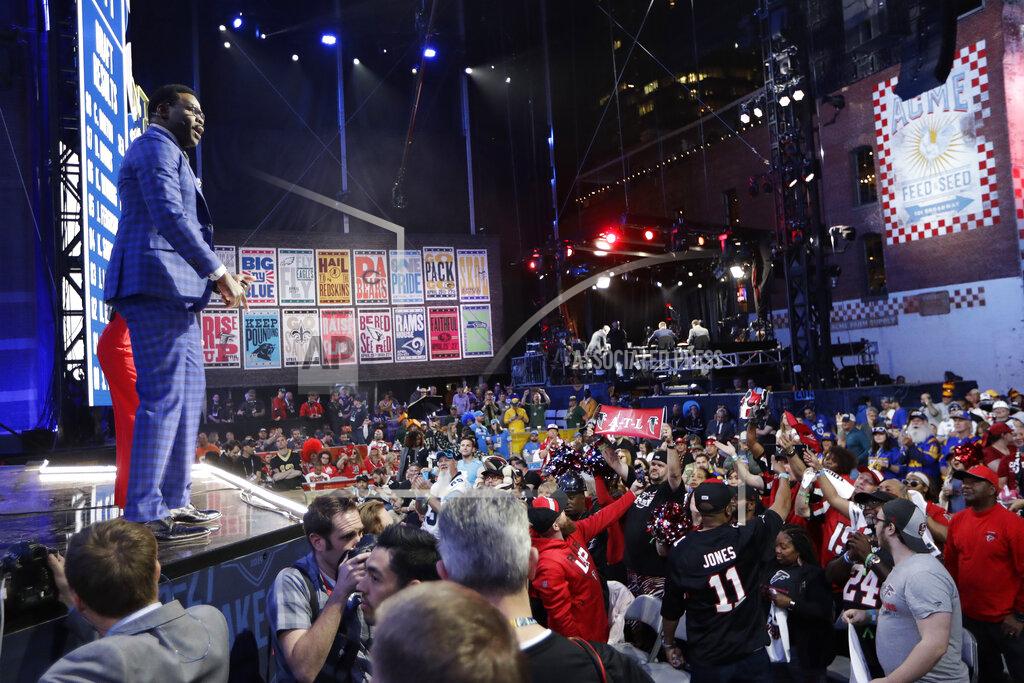 Former Dallas Cowboys player Michael Irvin speaks to fans during the third round of the NFL football draft, Friday, April 26, 2019, in Nashville, Tenn. (AP Photo/Mark Humphrey)