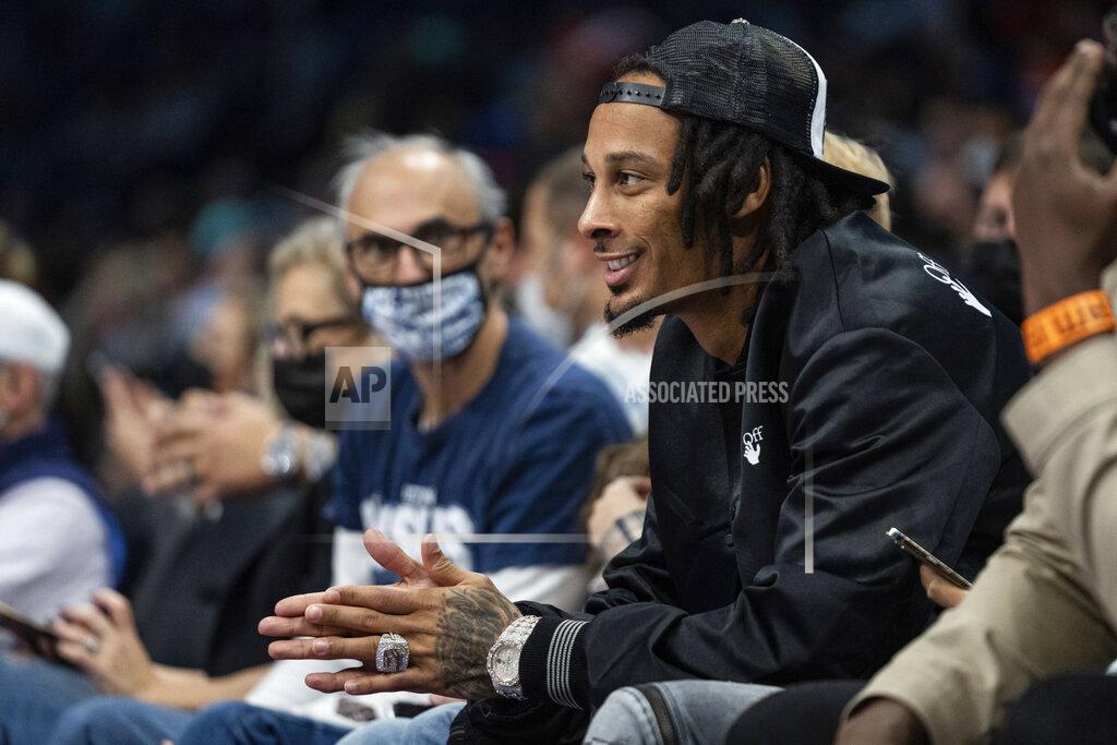 Jacob Kupferman Carolina Panthers wide receiver Robby Anderson looks on during the first half of an NBA basketball game between the Charlotte Hornets and the New York Knicks in Charlotte, N.C., Friday, Nov. 12, 2021. (AP Photo/Jacob Kupferman)