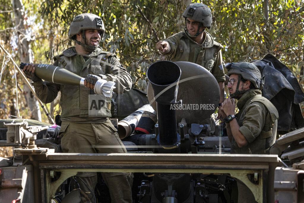 Tsafrir Abayov Israeli soldiers load ammunition onto an Armored Personal Carrier (APC) at a staging ground near the Israeli Gaza border, Friday, May 14, 2021. (AP Photo/Tsafrir Abayov)