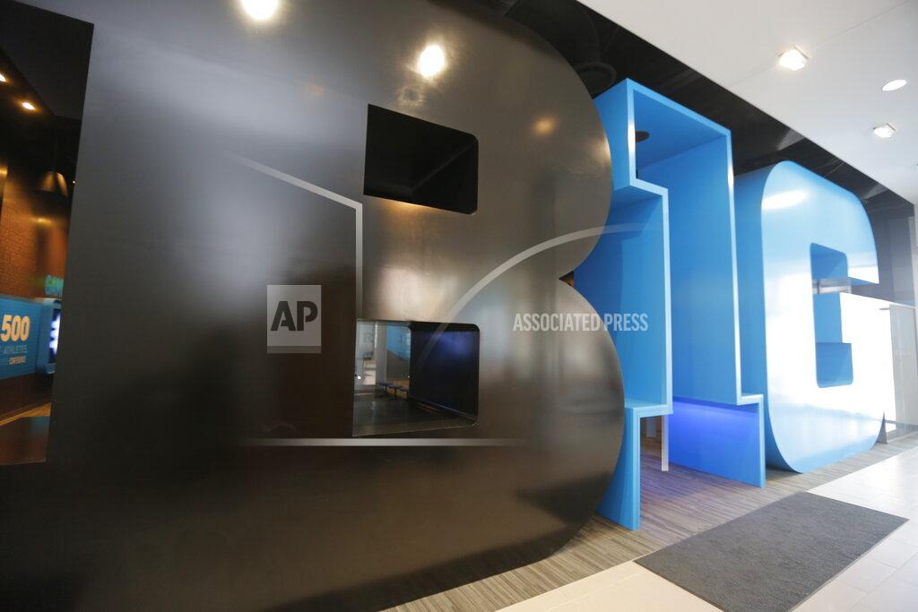 M. Spencer Green FILE - This March 7, 2014, file photo shows the entrance to The Big Ten Experience on the ground floor of the Big Ten conference headquarters in Rosemont, Ill. There are 130 major college football teams, spread across 41 states and competing in 10 conferences, save for a handful of independents. The goal is to have all those teams start the upcoming season at the same time — whether that's around Labor Day as scheduled or later — and play the same number of games. (AP Photo/M. Spencer Green, File)