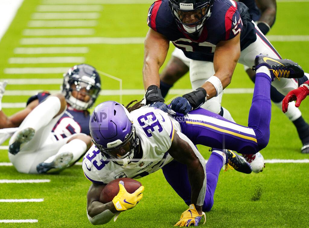 David J. Phillip Minnesota Vikings running back Dalvin Cook (33) dives for extra yards against the Houston Texans during the first half of an NFL football game Sunday, Oct. 4, 2020, in Houston. (AP Photo/David J. Phillip)
