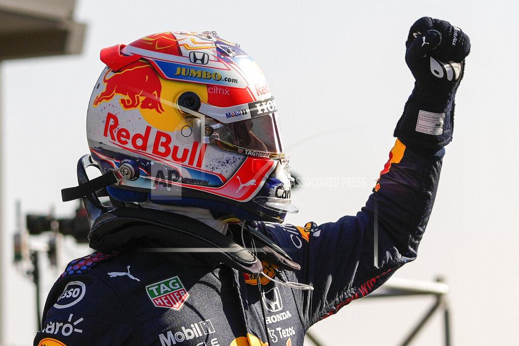 Francisco Seco Red Bull driver Max Verstappen of the Netherlands celebrates clinching the pole position after the qualifying session for Sunday's Formula One Dutch Grand Prix at the Zandvoort racetrack, Netherlands, Saturday, Sept. 4, 2021. (AP Photo/Francisco Seco, Pool)