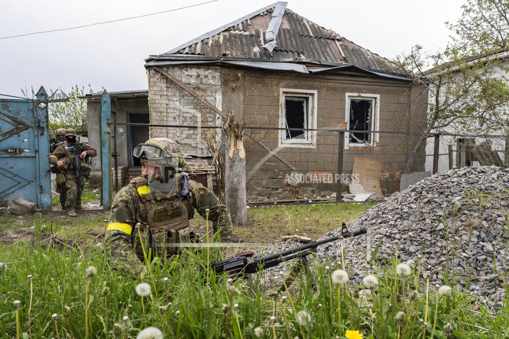 Bernat Armangue Ukrainian National Guard patrol during a reconnaissance mission in a recently retaken village on the outskirts of Kharkiv, east Ukraine, Saturday, May 14, 2022. (AP Photo/Bernat Armangue)