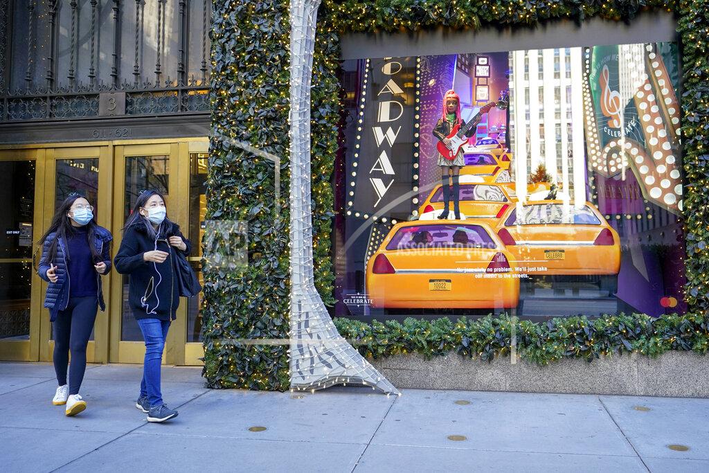 Mary Altaffer Black Friday shoppers wear face masks as the leave Saks Fifth Avenue flagships store empty handed, Friday, Nov. 27, 2020, in New York. (AP Photo/Mary Altaffer)