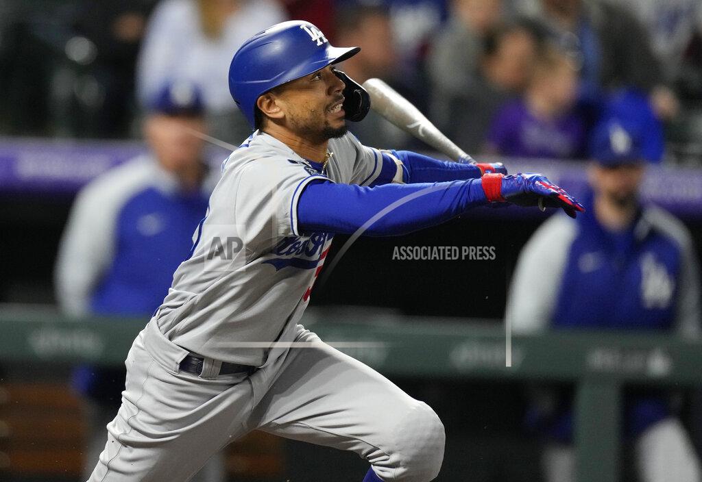 David Zalubowski Los Angeles Dodgers' Mookie Betts follows the flight of his RBI-single off Colorado Rockies starting pitcher Antonio Senzatela in the fifth inning of a baseball game Tuesday, Sept. 21, 2021, in Denver. (AP Photo/David Zalubowski)