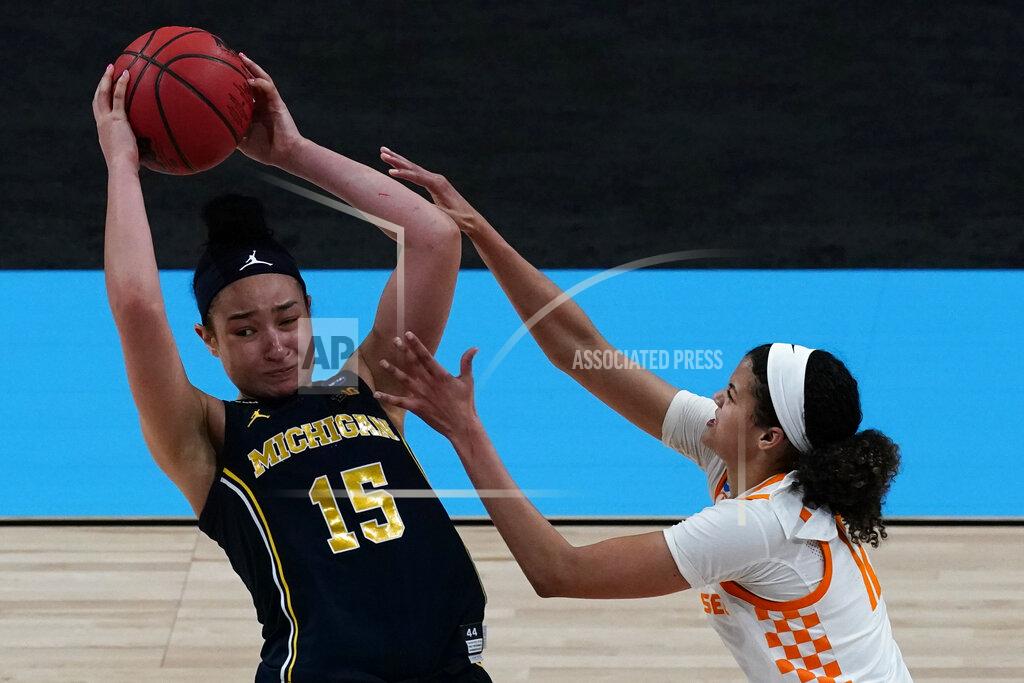 Charlie Riedel Michigan forward Hailey Brown (15) is pressured by Tennessee guard Rae Burrell (12) during the second half of a college basketball game in the second round of the women's NCAA tournament at the Alamodome in San Antonio, Tuesday, March 23, 2021. Michigan won 70-55. (AP Photo/Charlie Riedel)