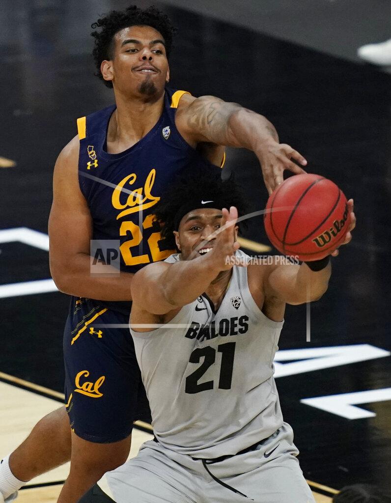 John Locher California's Andre Kelly (22) and Colorado's Evan Battey (21) battle for a rebound during the second half of an NCAA college basketball game in the quarterfinal round of the Pac-12 men's tournament Thursday, March 11, 2021, in Las Vegas. (AP Photo/John Locher)