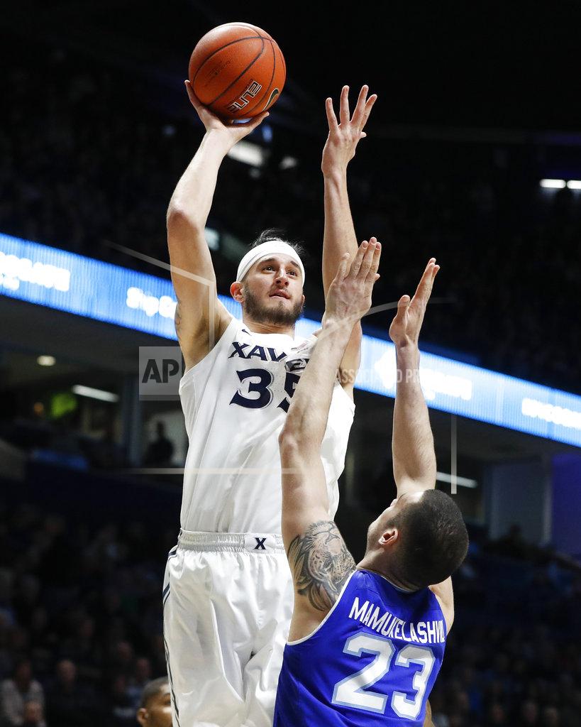 John Minchillo Xavier forward Zach Hankins (35) shoots over Seton Hall forward Sandro Mamukelashvili (23) during the first half of an NCAA college basketball game Wednesday, Jan. 2, 2019, in Cincinnati. (AP Photo/John Minchillo)