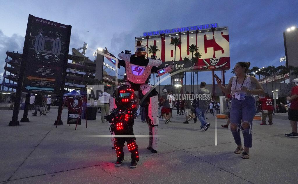 Chris O'meara Dancers perform outside Raymond James Stadium before an NFL football game between the Tampa Bay Buccaneers and the Dallas Cowboys Thursday, Sept. 9, 2021, in Tampa, Fla. (AP Photo/Chris O'Meara)