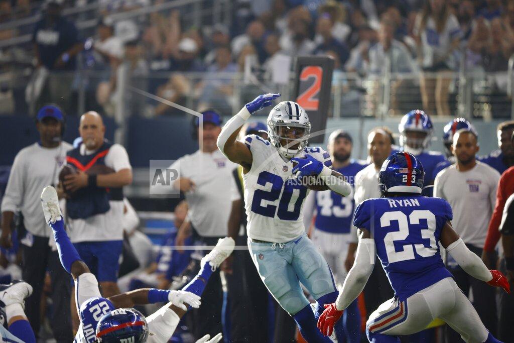 Ron Jenkins Dallas Cowboys running back Tony Pollard (20) runs the ball for a first down as New York Giants cornerback Logan Ryan (23) defends in the second half of an NFL football game in Arlington, Texas, Sunday, Oct. 10, 2021. (AP Photo/Ron Jenkins)
