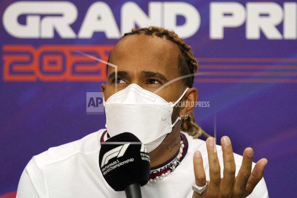 Hassan Ammar Mercedes driver Lewis Hamilton of Britain speaks during a press conference at the Formula One Bahrain International Circuit in Sakhir, Bahrain, Friday, March 18, 2022. The Bahrain Formula One Grand Prix will take place here on Sunday. (AP Photo/Hassan Ammar)