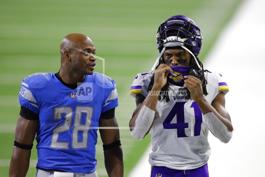 Al Goldis Detroit Lions running back Adrian Peterson (28) and Minnesota Vikings free safety Anthony Harris (41) walk off the field after their NFL football game, Sunday, Jan. 3, 2021, in Detroit. (AP Photo/Al Goldis)